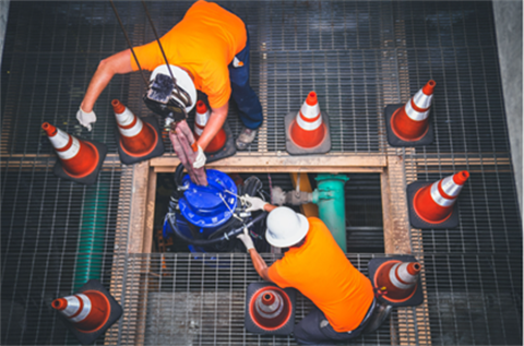 workers-with-orange-safety-cones
